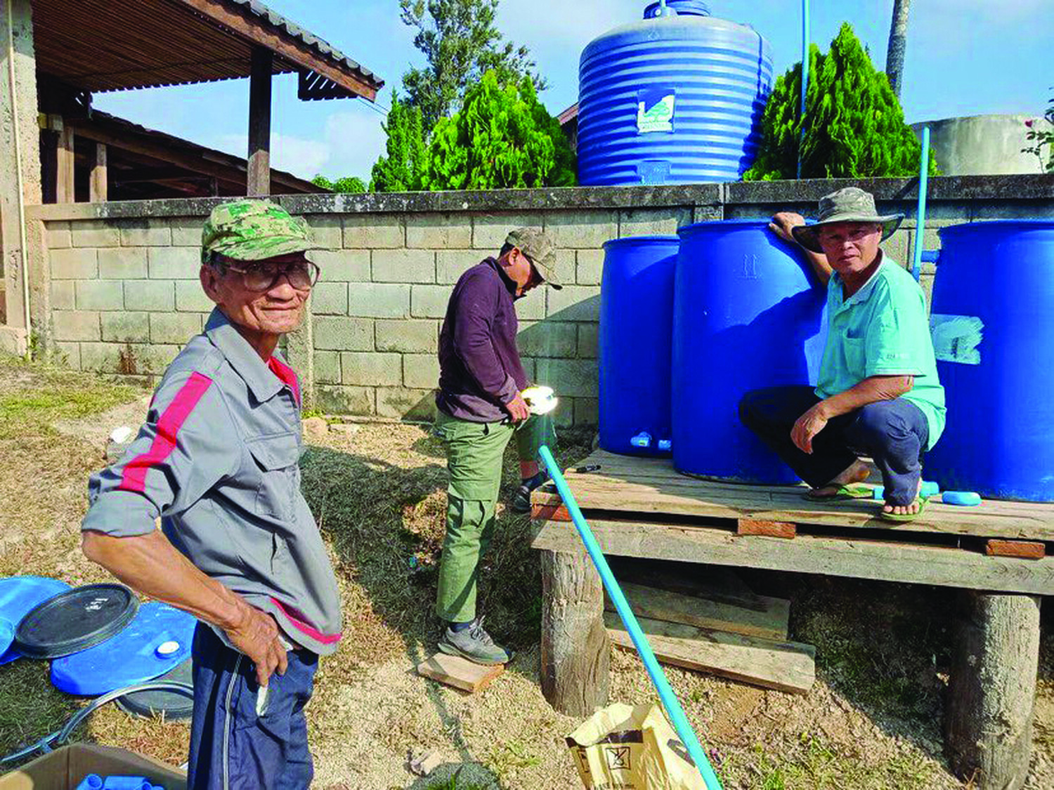 Village volunteers in Northern Thailand work together to construct a 300-liter biosand water filter — a process that they learned to build from ECHO.