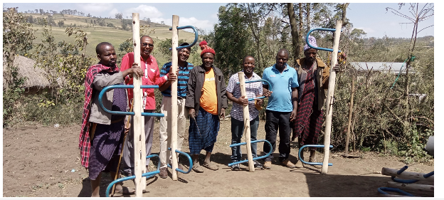 Ronald, Victor, and Phainos learned in the field with ECHO team
members and participated in village-level trainings on draft yokes.